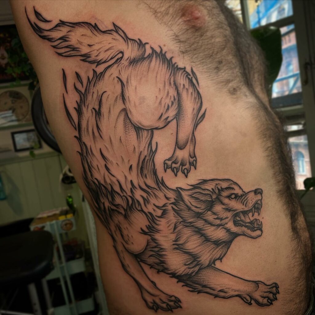 TOP 10 RIB TATTOOS DESIGNS FOR 2024 14 Wolf Rib Tattoo