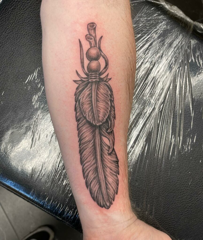 TOP 10 FEATHER TATTOO IDEAS + MEANINGS FOR 2024! 19 Feathered Wonder: A Whimsical Twist for Freedom