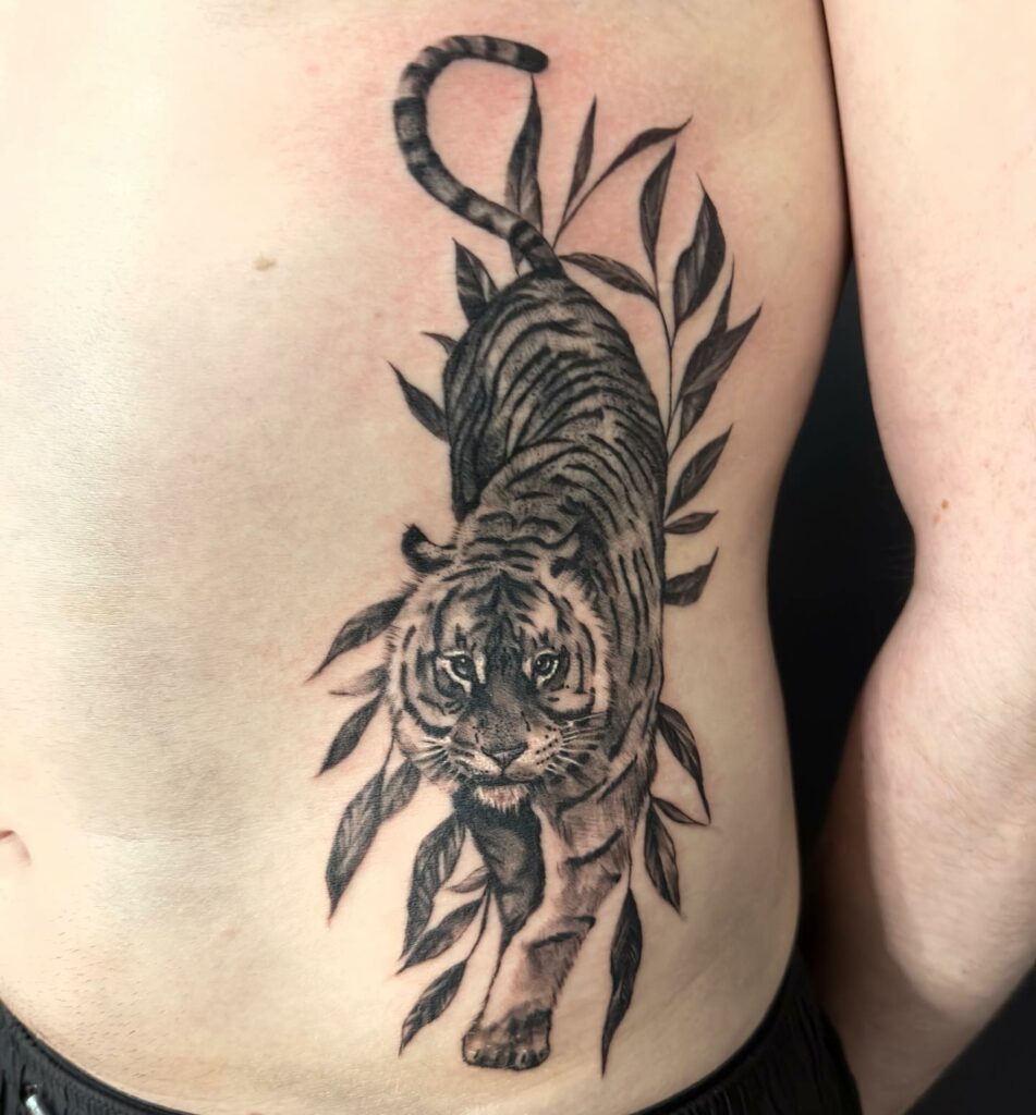 TOP 10 RIB TATTOOS DESIGNS FOR 2024 20 Tiger Rib Tattoo