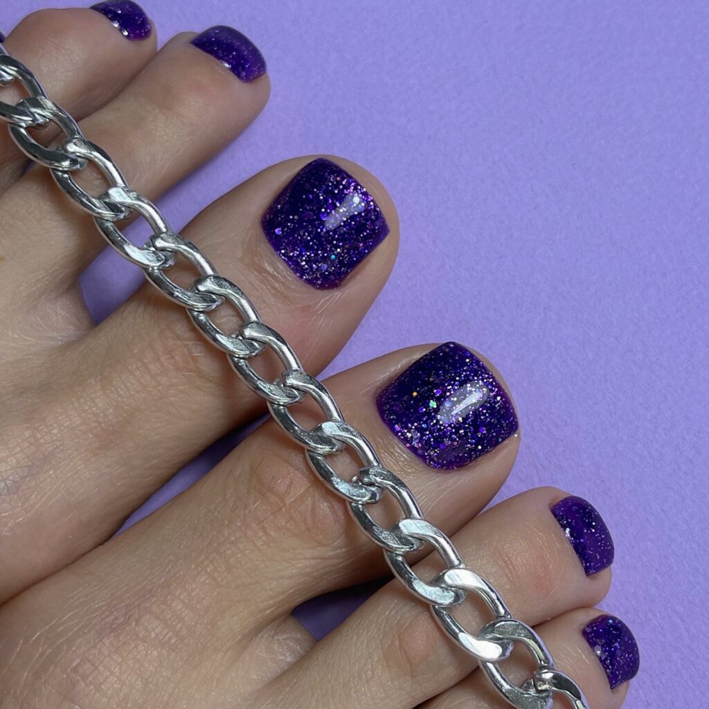 25 Latest Purple Pedicure Designs to Try In 2024! 16 Twilight Spark in Glittering Dark Purple Pedicure
