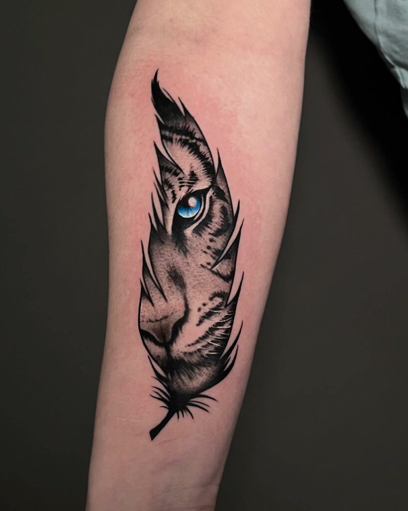 TOP 10 FEATHER TATTOO IDEAS + MEANINGS FOR 2024! 16 Enchanting Feather Tattoo: Eye of a Bird within Delicate Wings