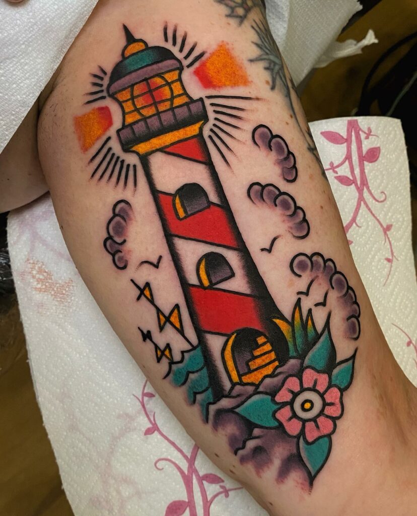 11 LIGHTHOUSE TATTOOS IDEAS + MEANINGS - UPDATED 2024 18 American Traditional Lighthouse Tattoos
