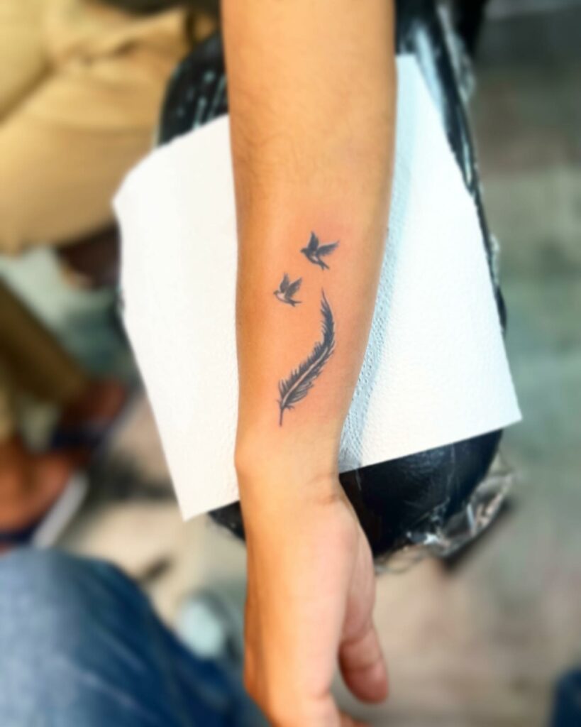 20+ AMAZING WRIST TATTOOS + MEANINGS IN 2024 25 Feather Wrist Tattoo