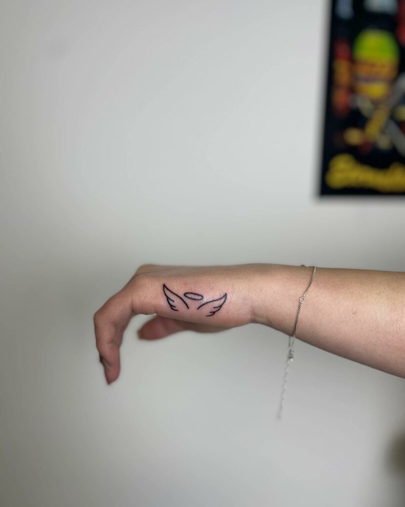 TOP 10 WING TATTOOS + MEANINGS WE'VE SEEN IN 2024 13 Angel Wings with Halo Tattoo