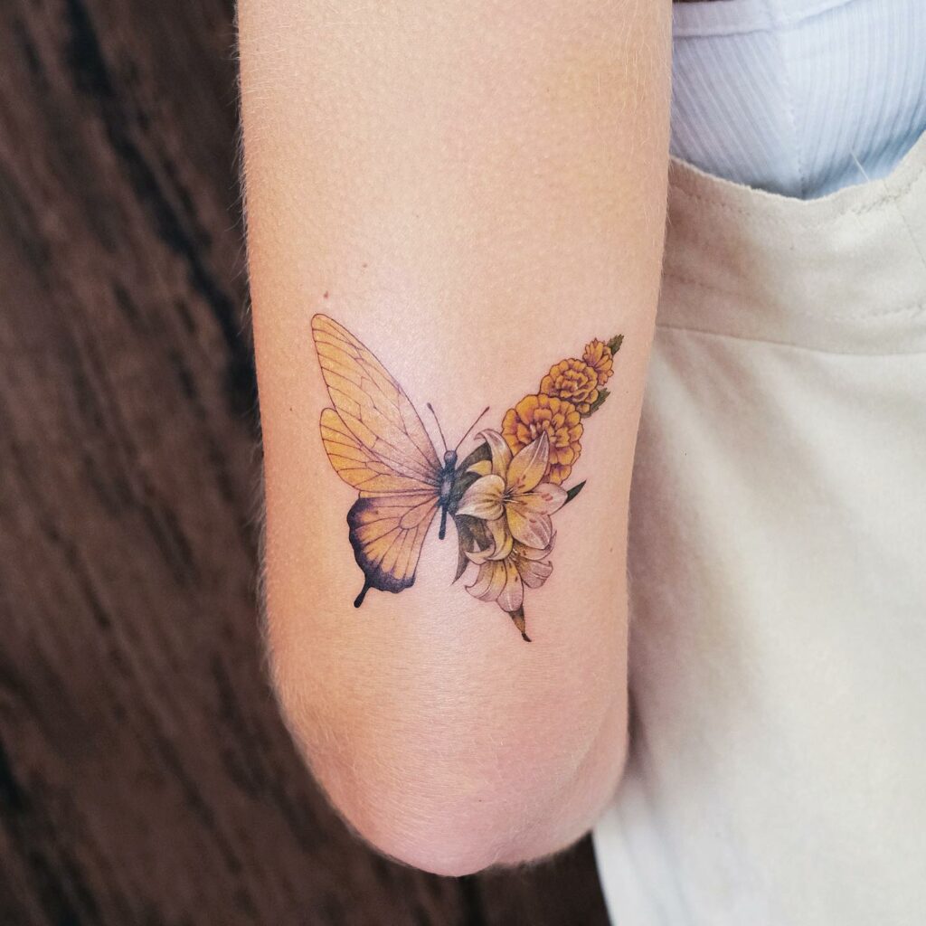 AMAZING MARIGOLD TATTOO DESIGNS & MEANINGS TO INSPIRE YOU IN 2024 19 Marigold and Butterfly Tattoo