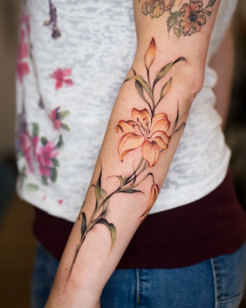 AMAZING LILY TATTOO DESIGNS + A DEEP DIVE INTO THEIR MEANINGS IN 2024 11 Lily Tattoo