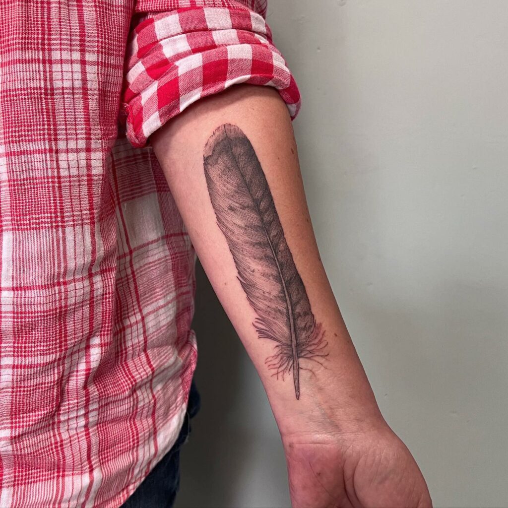TOP 10 FEATHER TATTOO IDEAS + MEANINGS FOR 2024! 12 Nature's Flight: Delicate Feather Tattoo Art