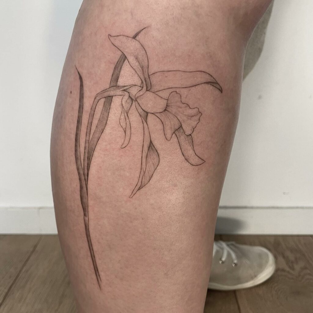 AMAZING ORCHID TATTOOS + THEIR COOL MEANINGS 26 One-Line Orchid Tattoo