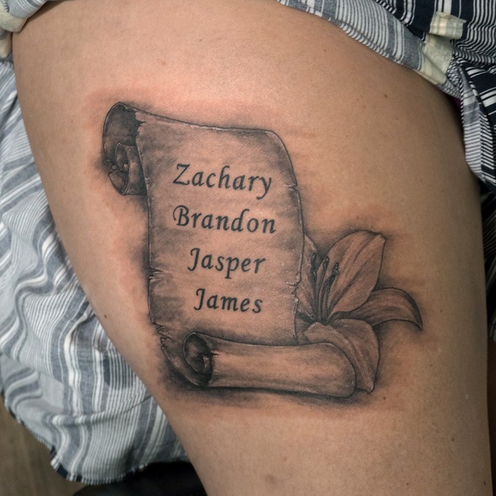 AMAZING LILY TATTOO DESIGNS + A DEEP DIVE INTO THEIR MEANINGS IN 2024 19 Lily Tattoos with Lettering or Name tattoo