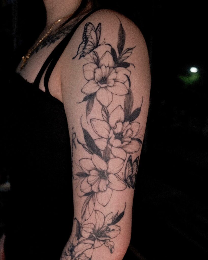AMAZING LILY TATTOO DESIGNS + A DEEP DIVE INTO THEIR MEANINGS IN 2024 18 Butterfly and Lily Tattoo