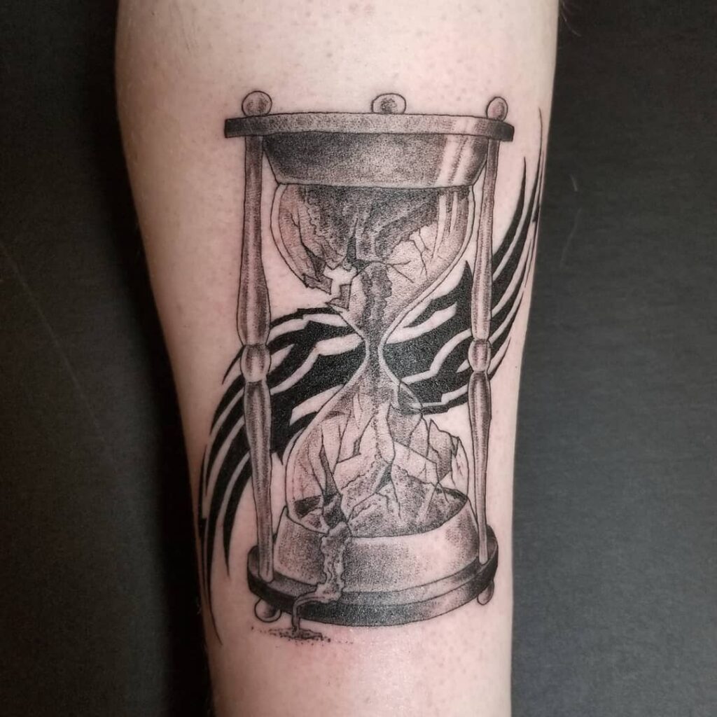 10 AMAZING HOURGLASS TATTOOS & THEIR MEANINGS - UPDATED FOR 2024 17 Broken Hourglass Tattoos