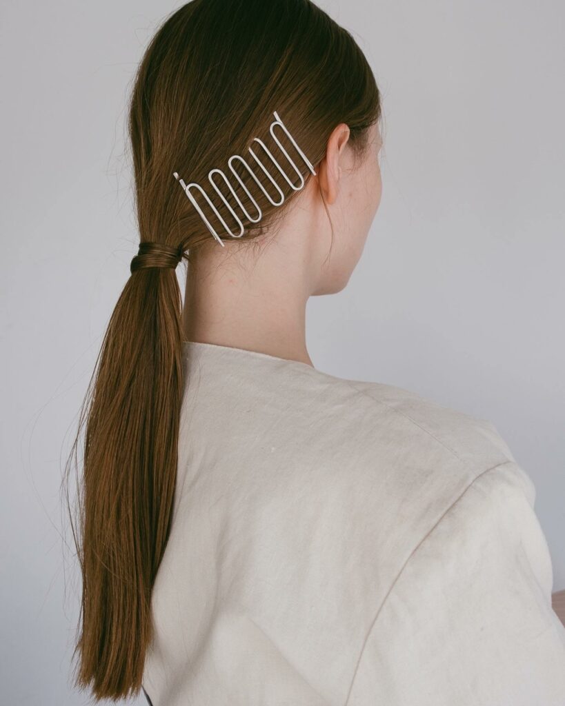 35 Ponytail Hairstyles Ideas for Effortless Elegance in 2024 28 The Artful Ponytail with Bobby Pins
