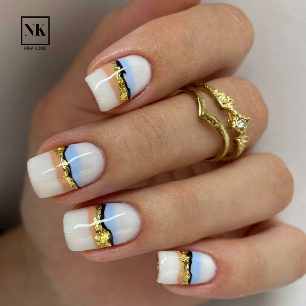 30 Latest White And Gold Nail Ideas To Try In 2024! 37 White Nails With Horizontal Color Gold Stripes