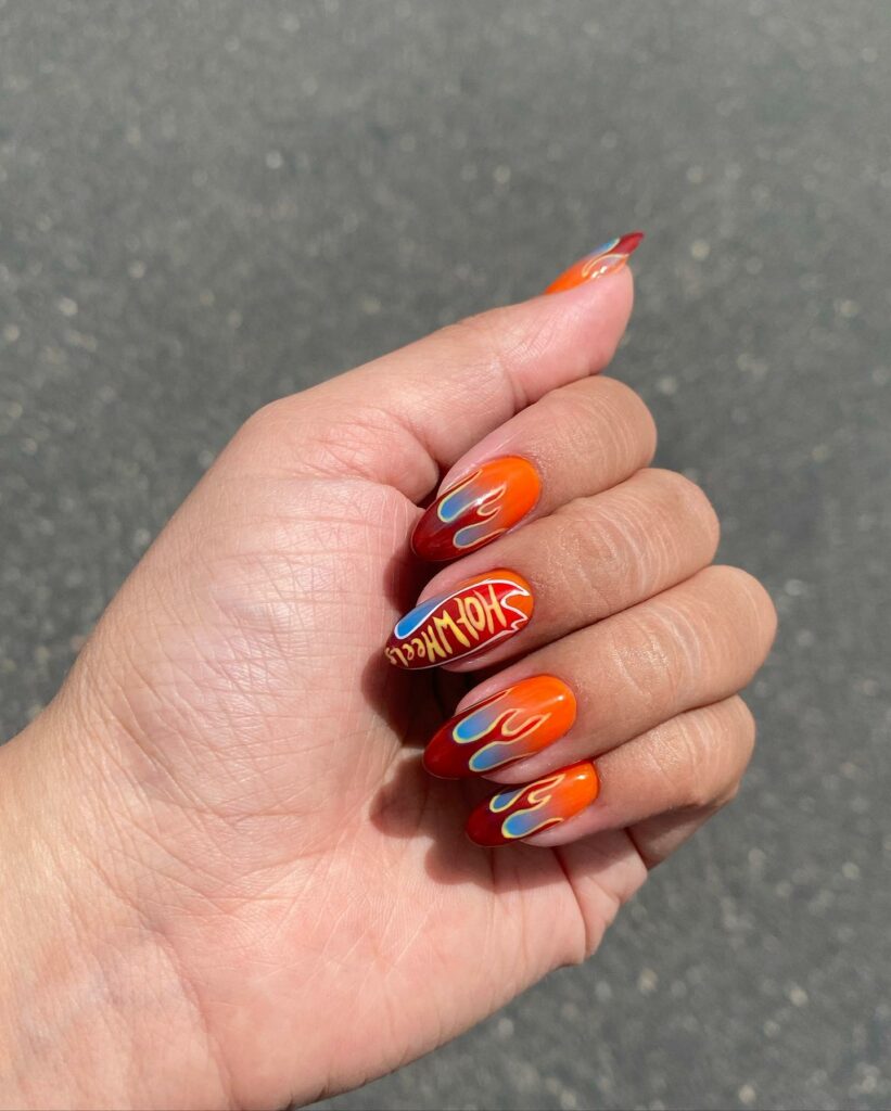 20 Latest Orange And Blue Nail Ideas To Try In 2024! 22 Orange And Blue Ombre Nails With Flame Design