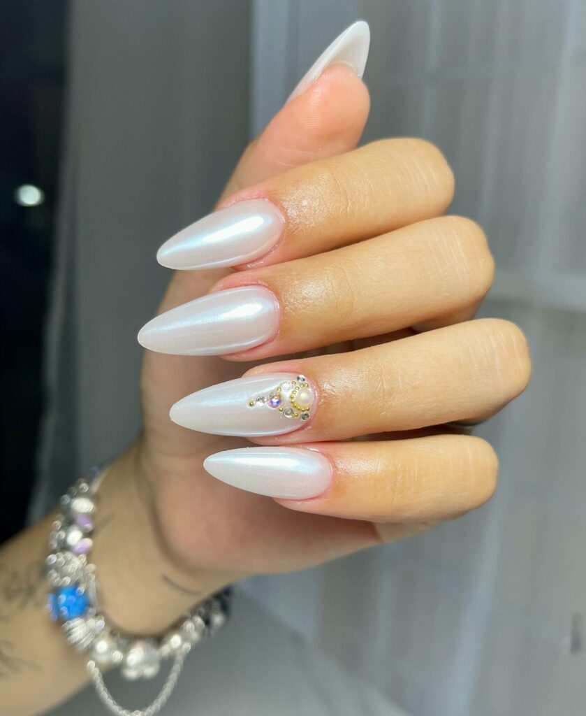 Glow with 20 Pearl White Nail Designs in 2024 16 Long Almond Nails With Rhinestones