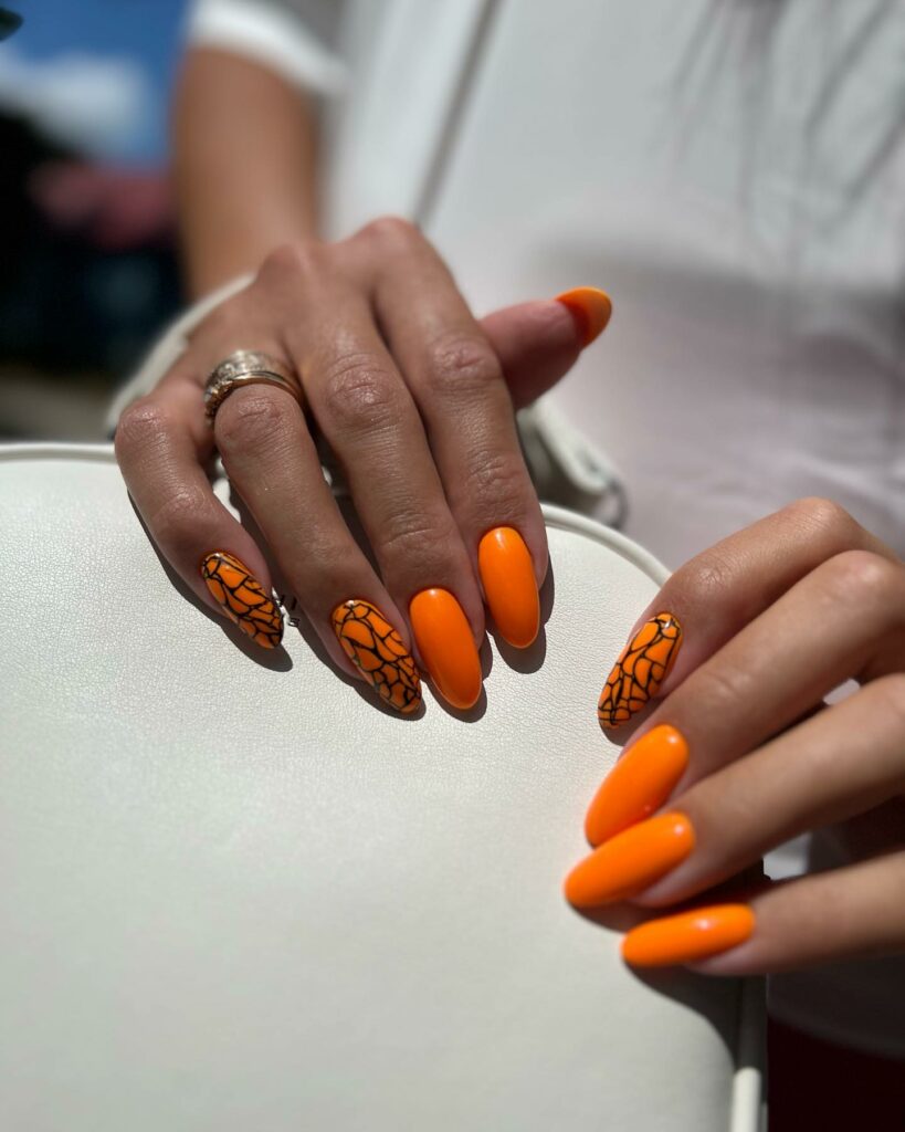 Get Inspired by 30 Neon Orange Nail Designs of 2024 43 Snake Print Mani