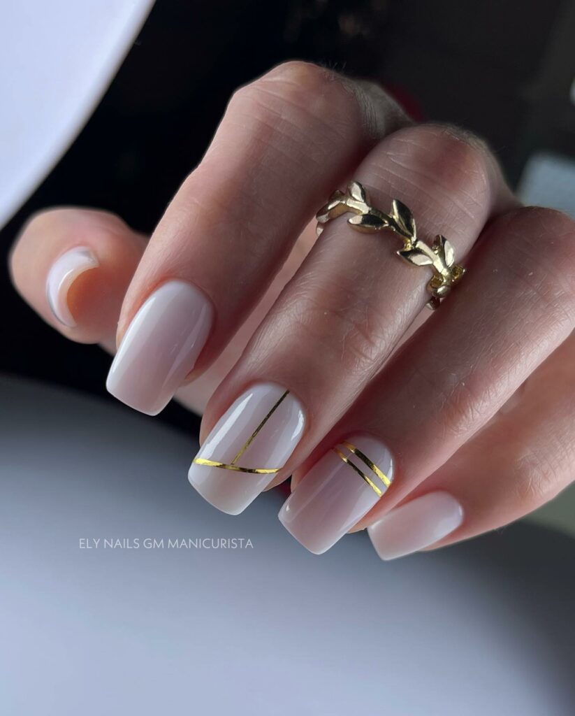30 Latest White And Gold Nail Ideas To Try In 2024! 23 Square-Shaped White Nails With Gold Stripes