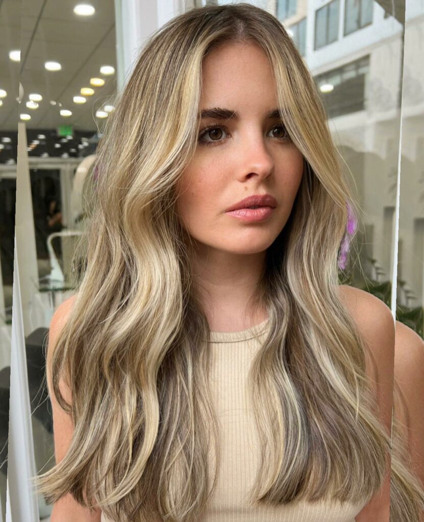 45 Wispy Long Curtain Bang Hairstyles to Try in 2024 23 Sandy Blonde Hair with Long Curtain Bangs