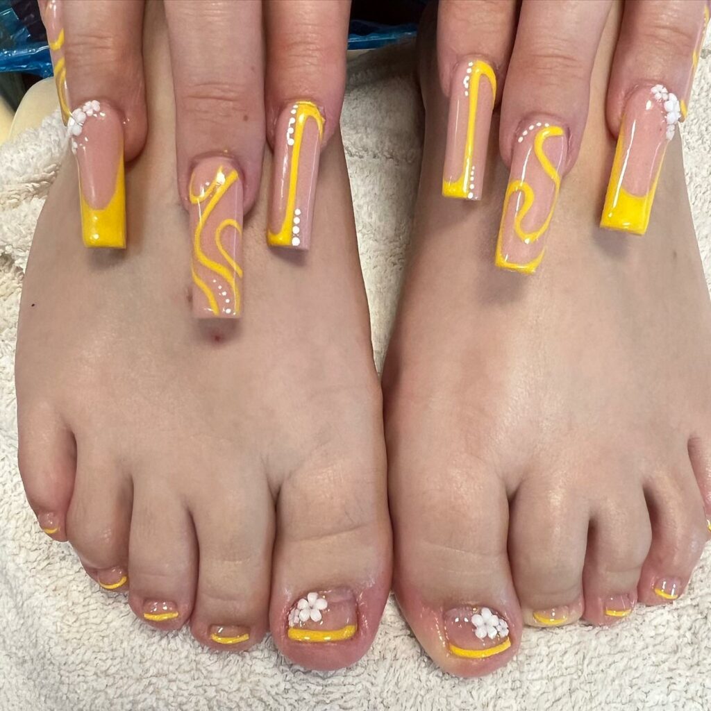 30 Yellow Pedicure Ideas to Brighten Up Your Look in 2024 26 Yellow French With White Flower Design