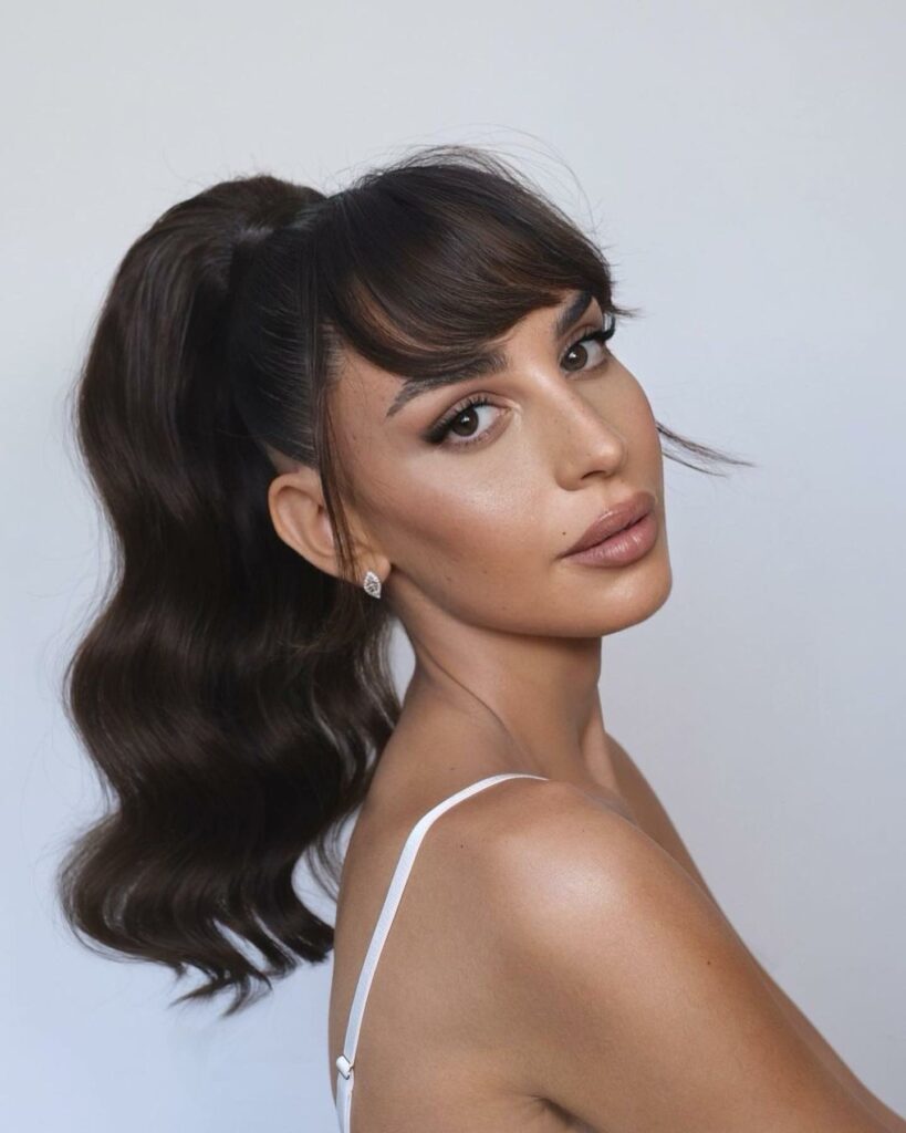 35 Ponytail Hairstyles Ideas for Effortless Elegance in 2024 37 Low Ponytail With Side-Swept Bangs