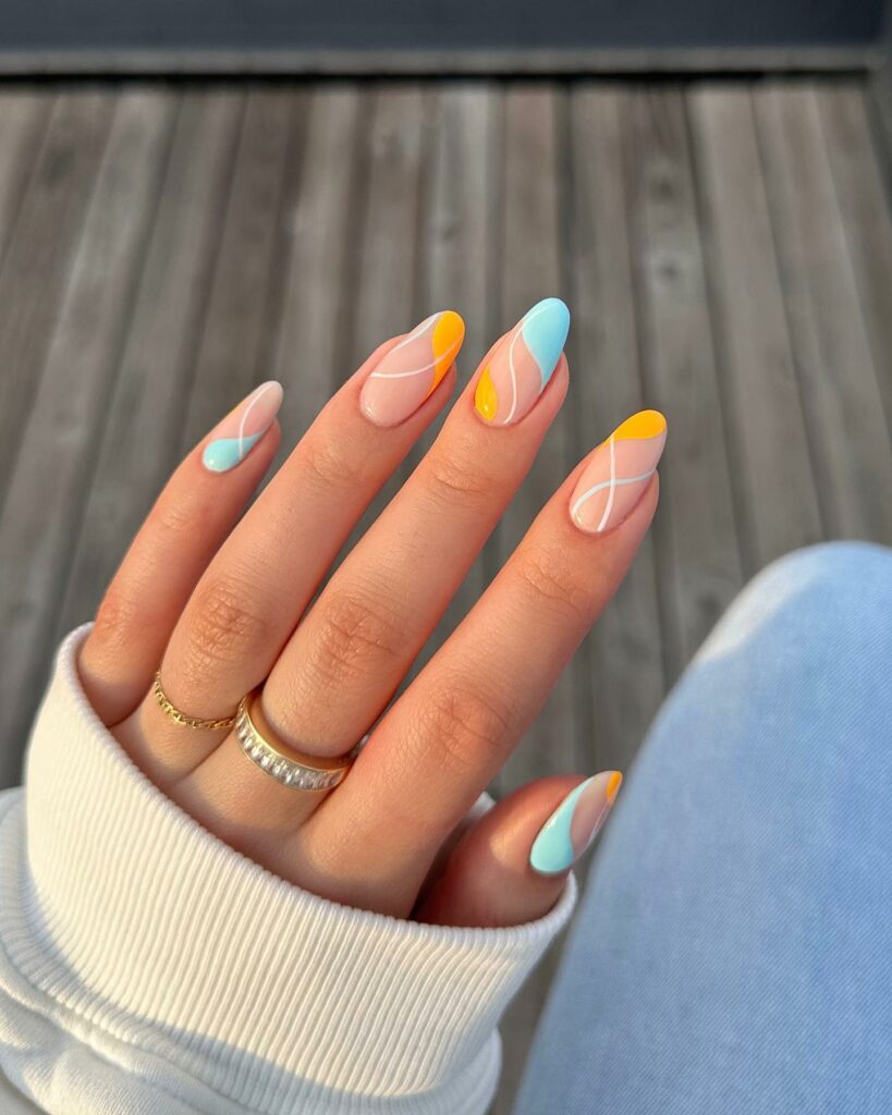 20 Latest Orange And Blue Nail Ideas To Try In 2024! 11 Orange And Blue Matte Abstract Nails