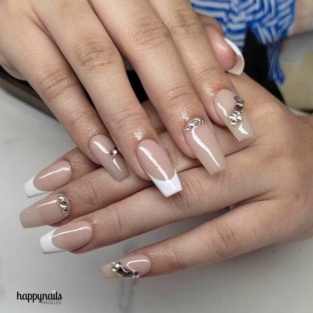 23 Latest Nude French Nail Designs To Try In 2024! 31 Nude And White French With Rhinestone Design