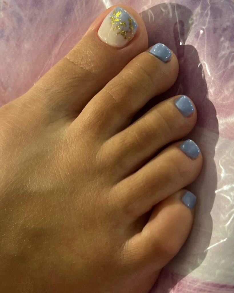 Indulge in 30 Baby Blue Toenail Pedicure Ideas for 2024 35 Ombre Baby Blue With Gold Flakes