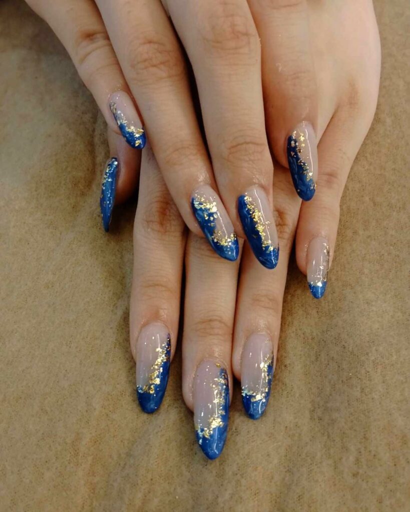 30 Latest Navy Blue Nail Designs To Try In 2024! 39 Marbled and Gold-Accented