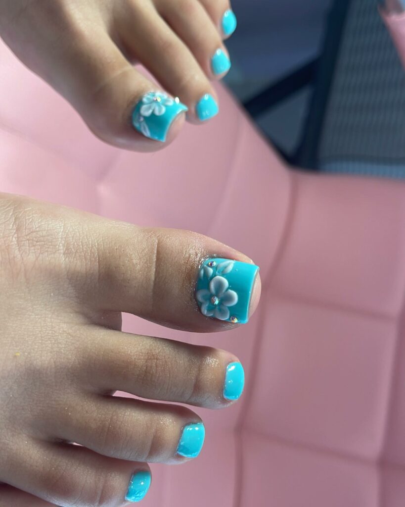 Indulge in 30 Baby Blue Toenail Pedicure Ideas for 2024 13 Baby Blue Pedicure With Flower Nail Art
