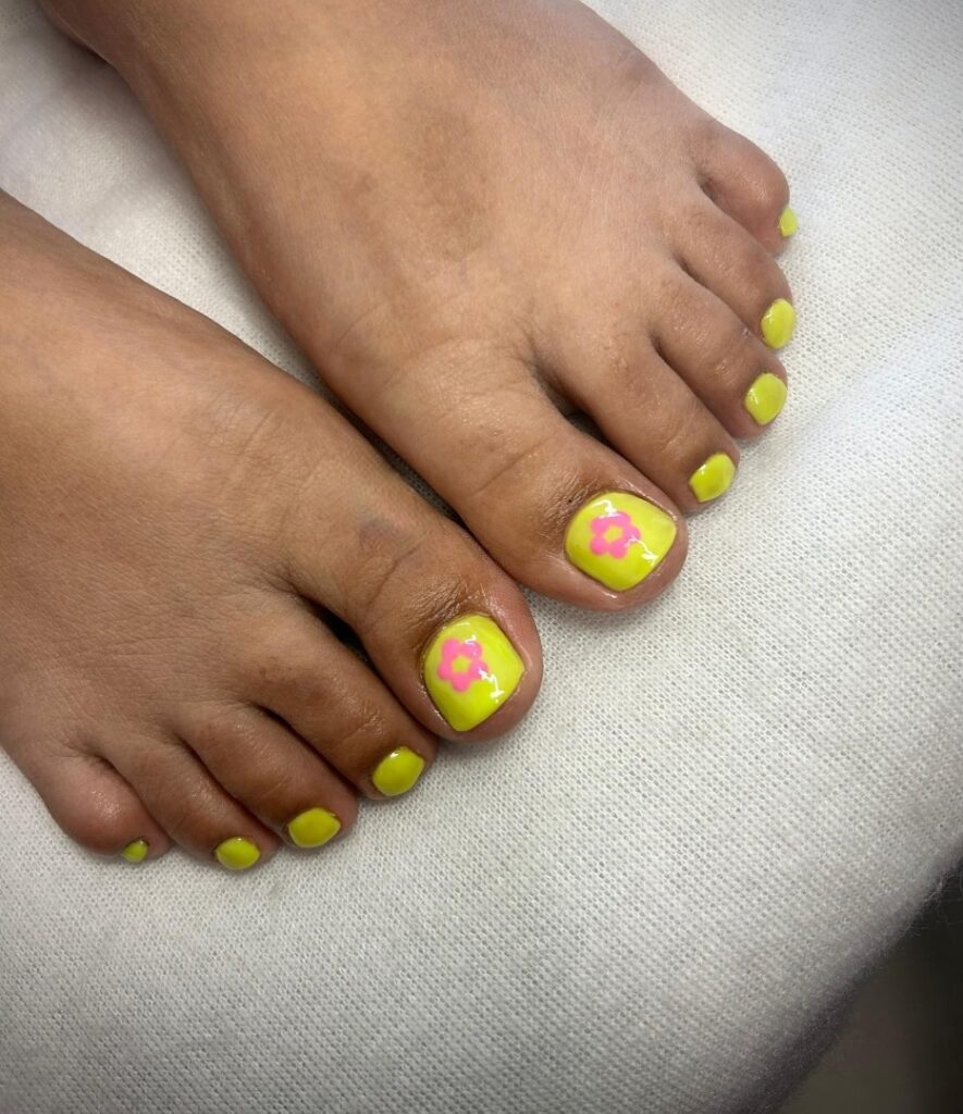 30 Yellow Pedicure Ideas to Brighten Up Your Look in 2024 15 Yellow Pedicure With Pink Flower