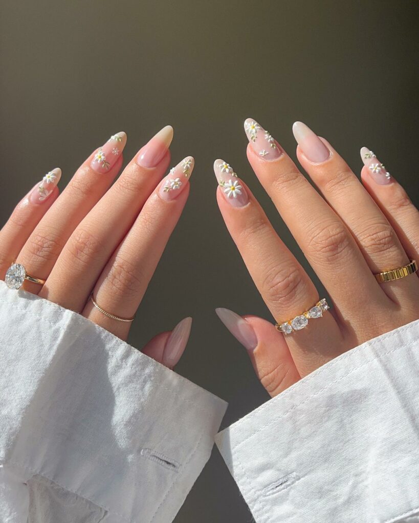 40 Latest Trendy Nail Ideas To Try In 2024! 25 Nude Almond Trendy Nails With Daisy Flower