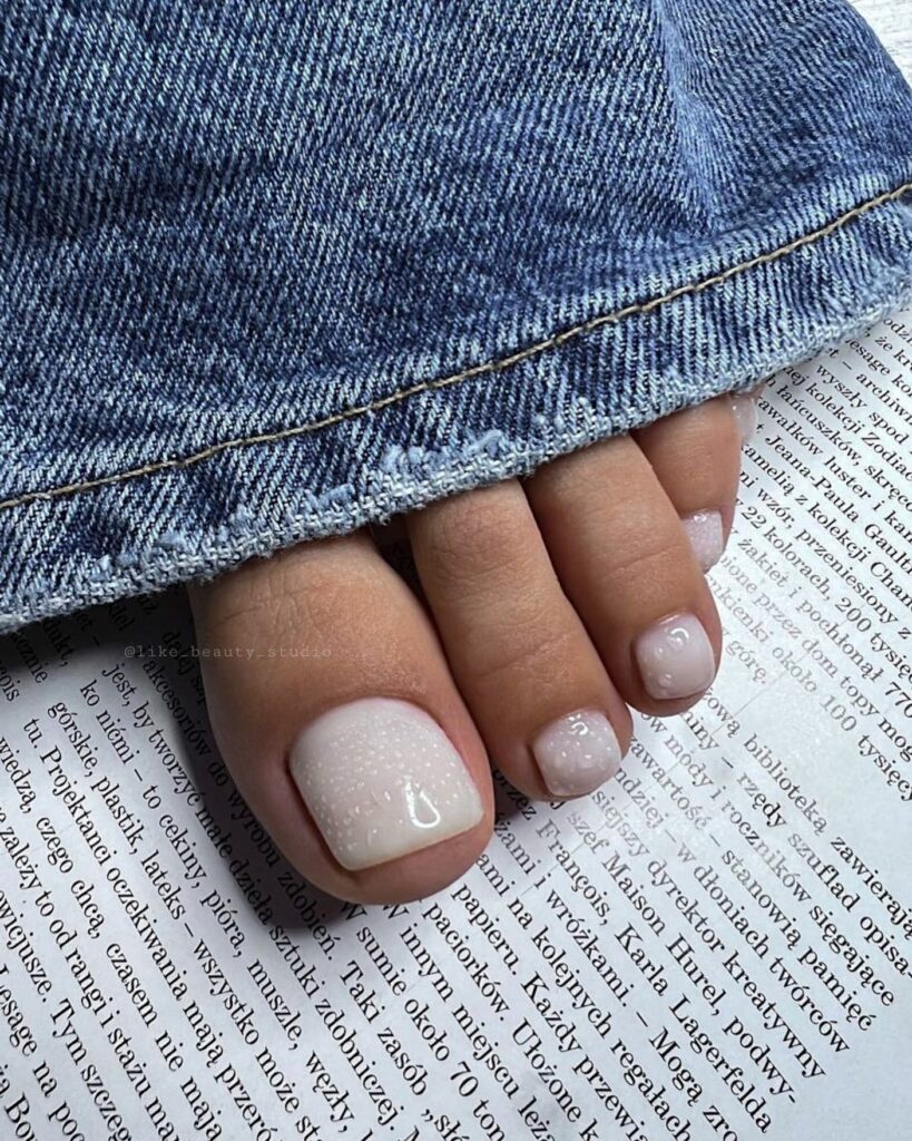 17 Latest Milky White Pedicure Designs To Try In 2024! 12 Milky White Pedicure With 3D Water Drops Design
