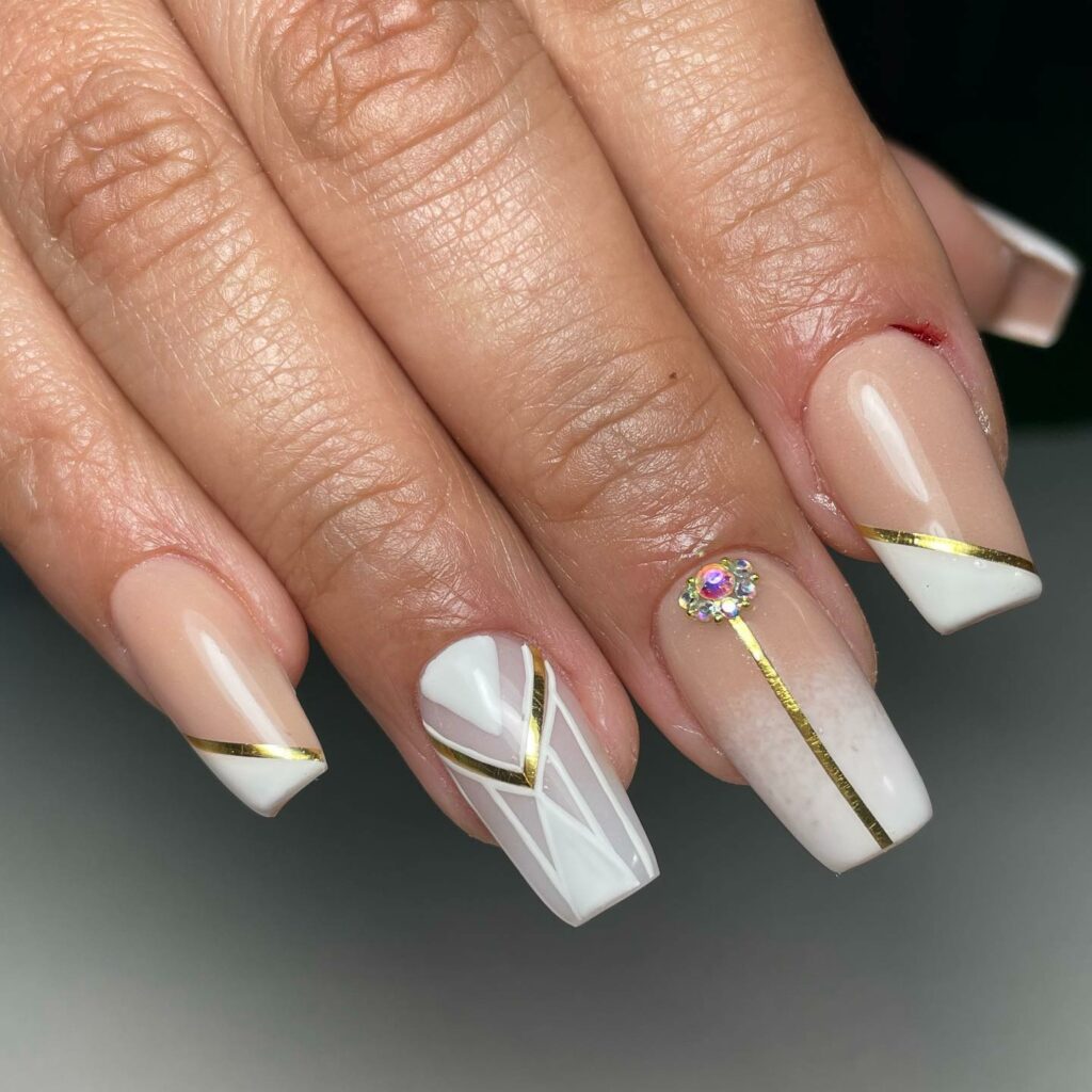 Try 50 Coffin French Tip Nail Designs in 2024 15 Golden Streaks & Rhinestone Peaks