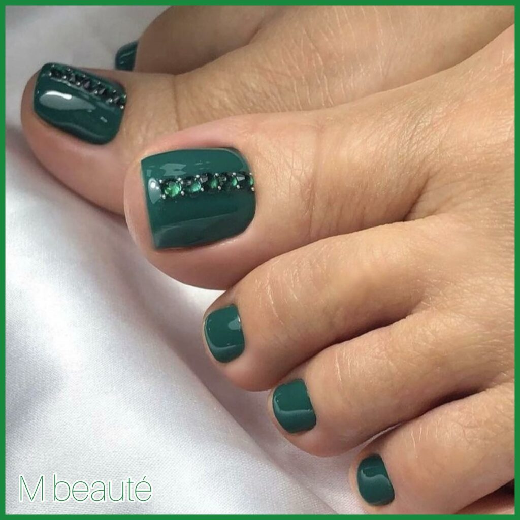 40 Latest Dark Green Pedicure Ideas To Try In 2024! 34 Dark Green Pedicure Adorned with Gems