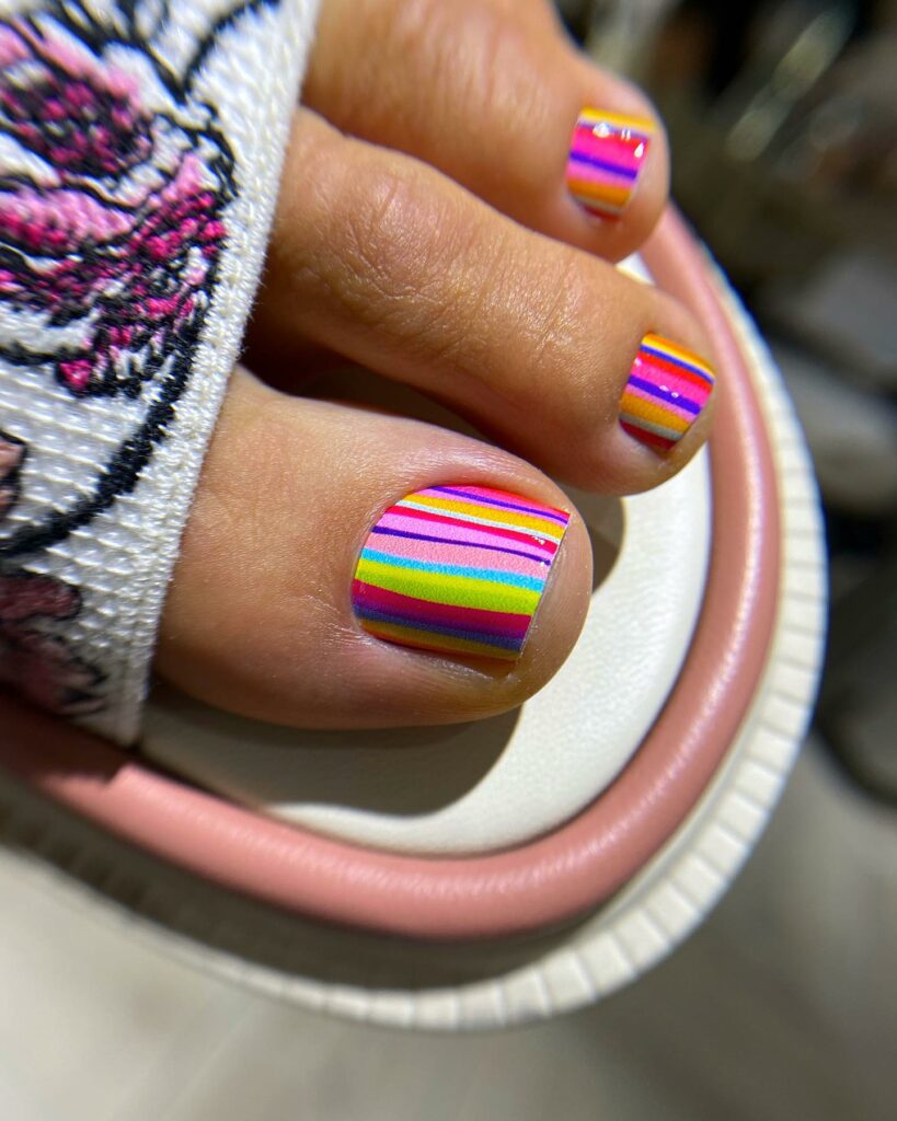 35 Rainbow Pedicure Ideas to Add Vibrancy to Your Look in 2024 13 Rainbow stripes