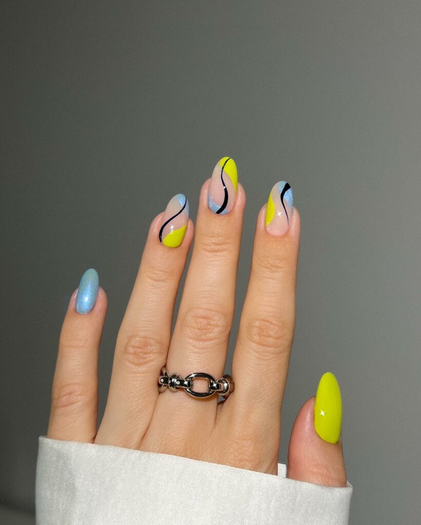 20 Latest Neon Yellow Nail Ideas To Try In 2024! 26 Neon Yellow And Blue Abstract Nails With Swirl
