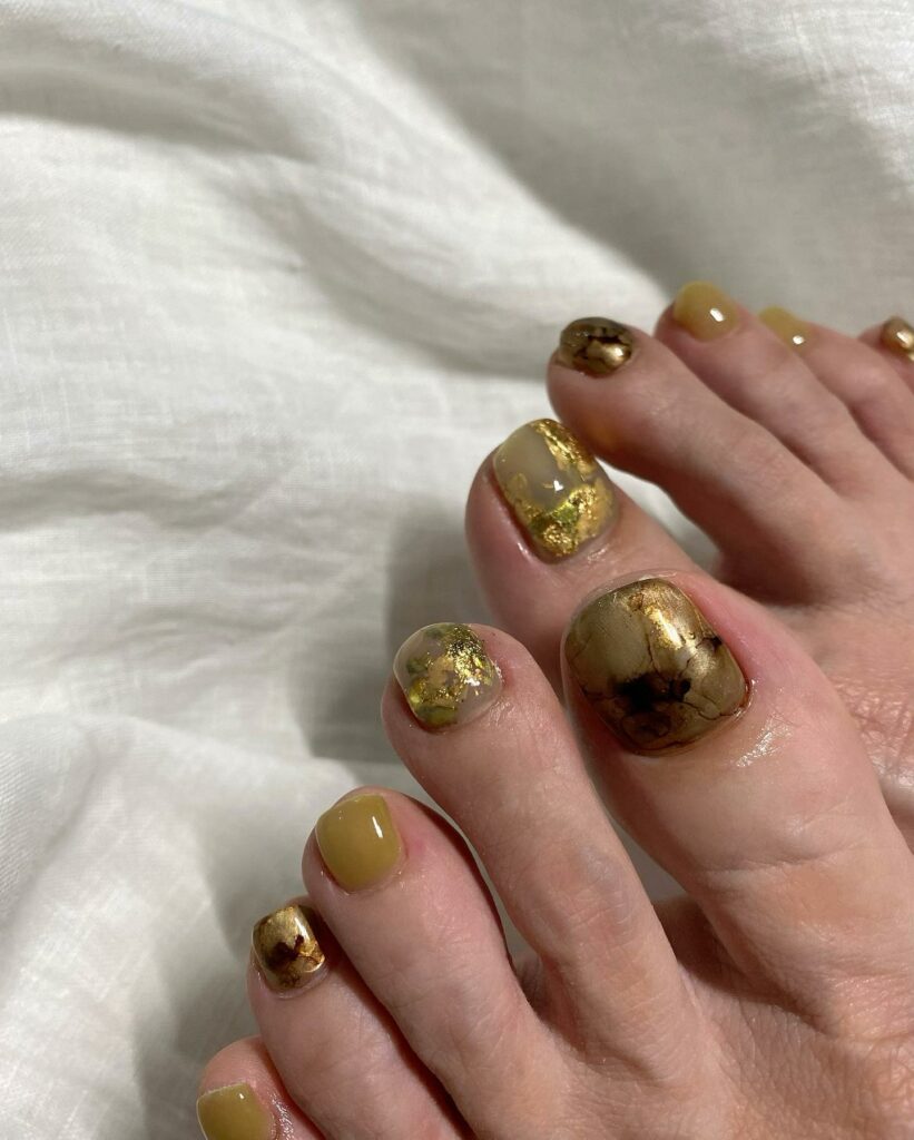 30 Gold Pedicure Ideas to Add Glamour to Your Look in 2024 22 Gold Galaxy Design
