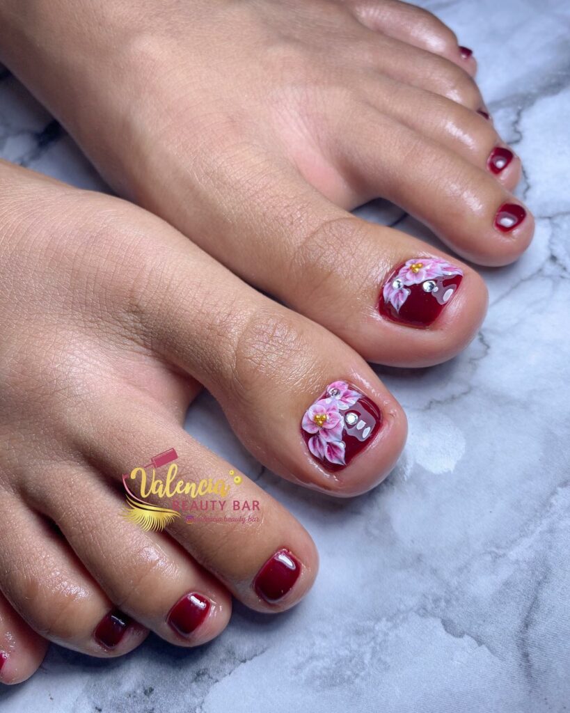 20 Latest Flower Pedicure Designs To Try In 2024! 29 Red Pedicure With Cherry Blossom And Rhinestones
