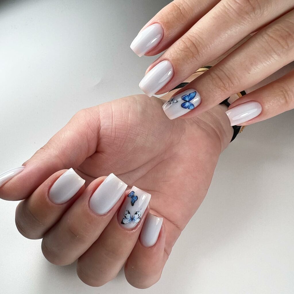 25 Latest Accent Nail Designs To Try In 2024! 32 White Square Accent Nails With Butterfly Design