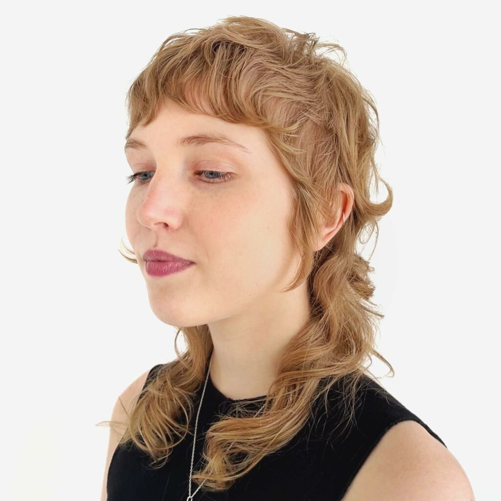 35 Modern Mullet Hairstyles to Experiment with in 2024 22 Mullet with Soft Curls
