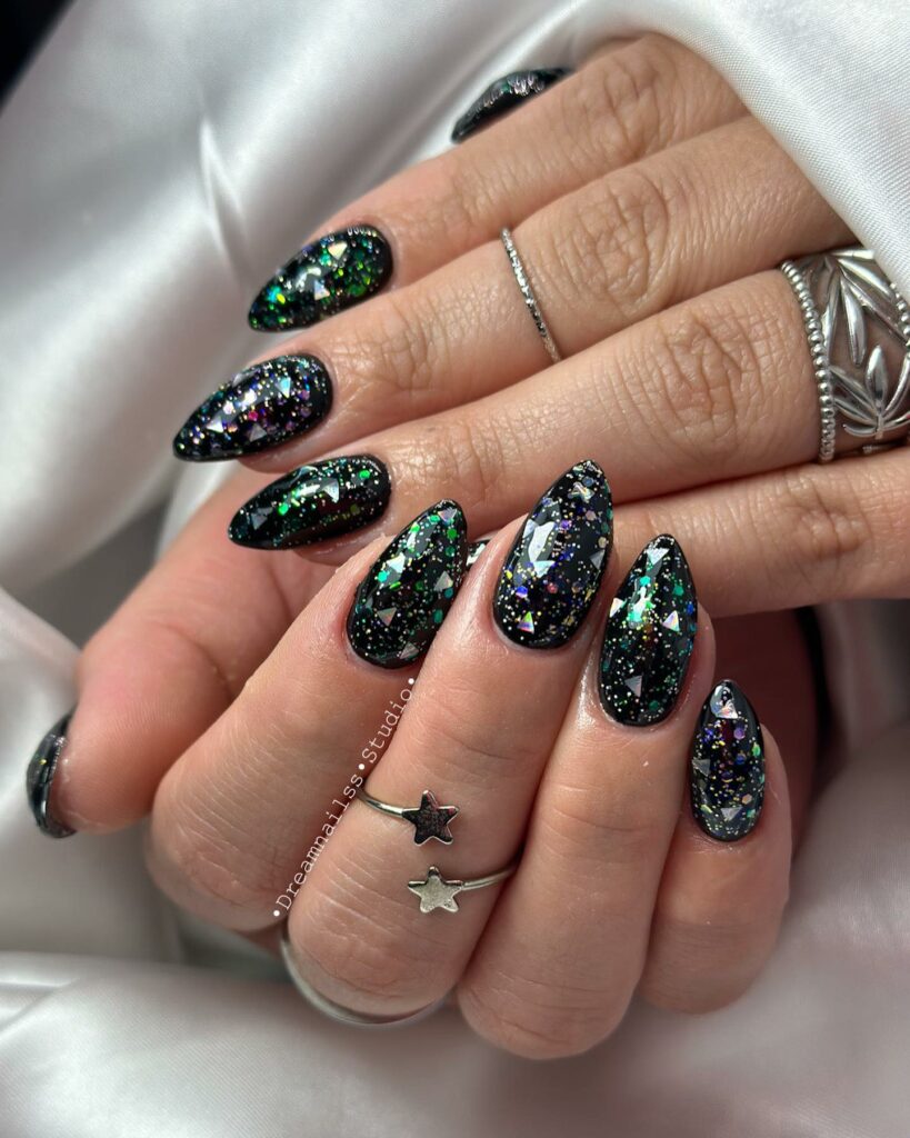19 Latest Black Glitter Nail Designs To Try In 2024! 19 Black Nails With Colorful Glitters