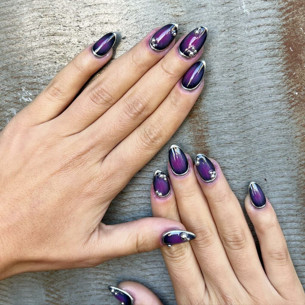 22 Latest Black And Purple Nail Ideas to Try in 2024! 39 Purple And Black Aura Nail With Rhinestones