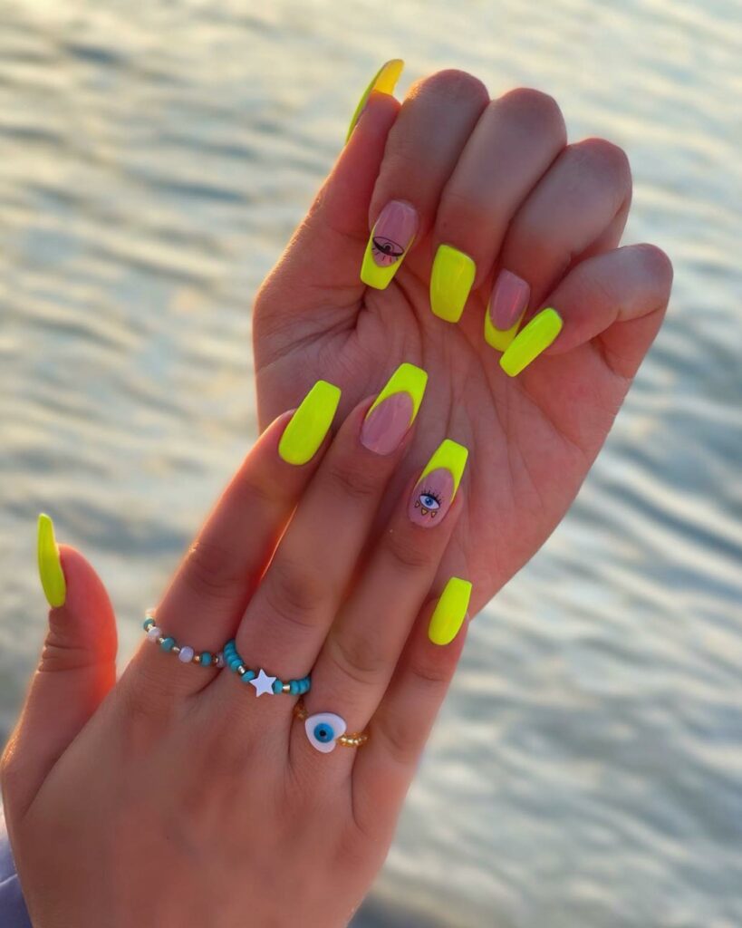 20 Latest Neon Yellow Nail Ideas To Try In 2024! 18 Neon Yellow Coffin Nails With Eye Of Ra Design