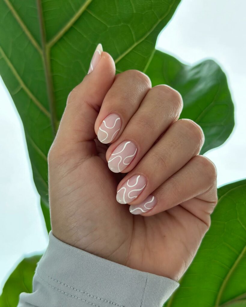 28 Latest Nude And White Nail Designs To Try in 2024! 31 Matte Nude And White Swirl Nails