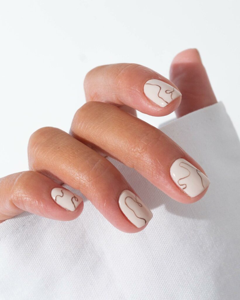 20 Latest Minimalist Nail Ideas To Try In 2024! 22 White Minimalist Short Nails With Swirl Design