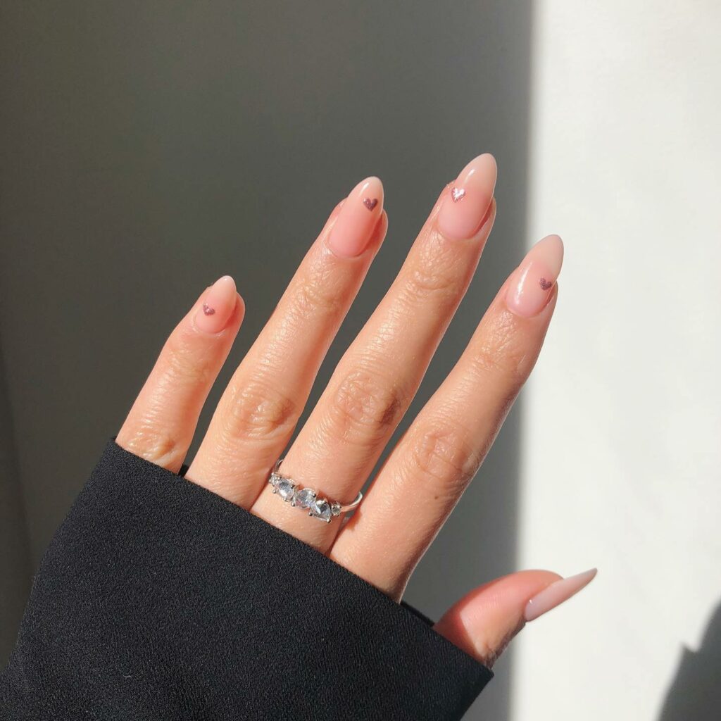 30 Latest Heart Nails Ideas To Try In 2024! 19 Chrome Hearts Design On Nude Almond Nails