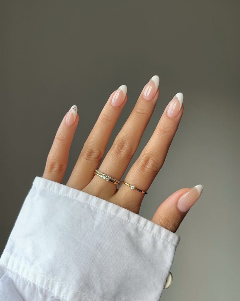 20 Latest Minimalist Nail Ideas To Try In 2024! 11 White French Minimalist Nails With Cute Spooky Ghost Design