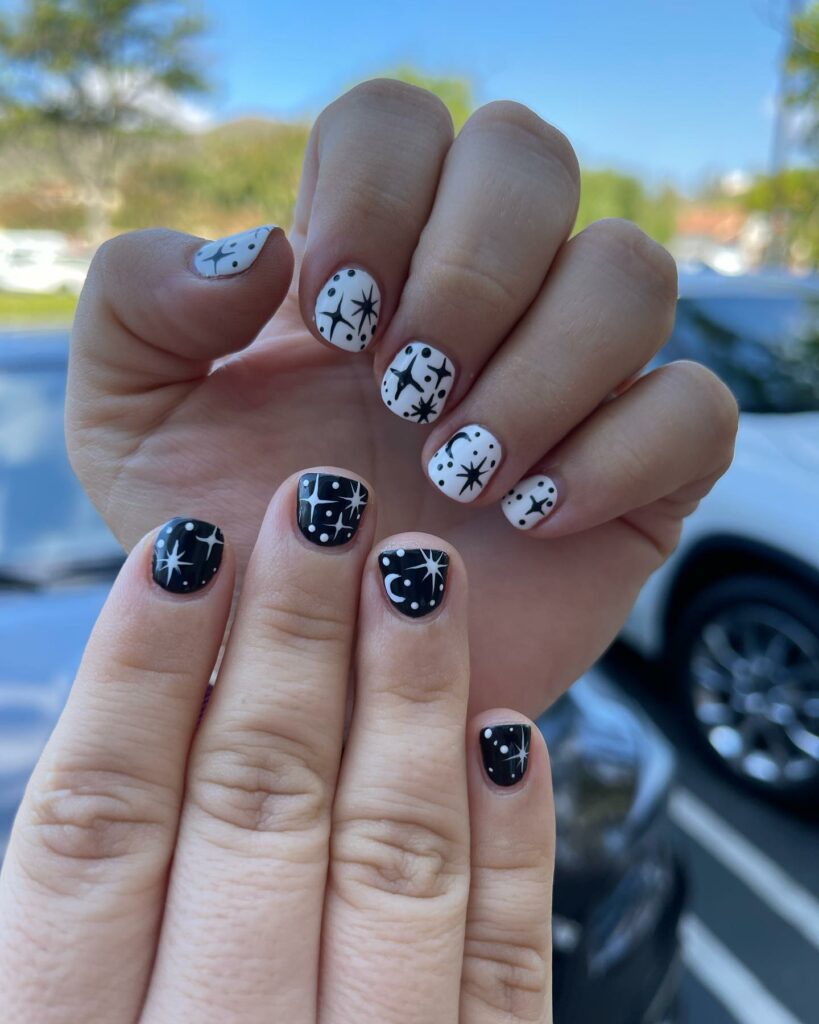 45 Latest Short Black Nail Designs To Try In 2024! 41 Short Black Nail With Moon and Stars