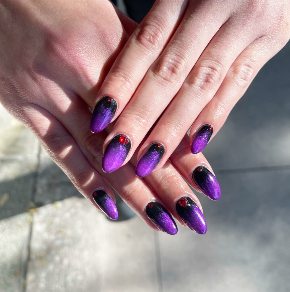 22 Latest Black And Purple Nail Ideas to Try in 2024! 38 Purple And Black Ombre Nail With Red Stone