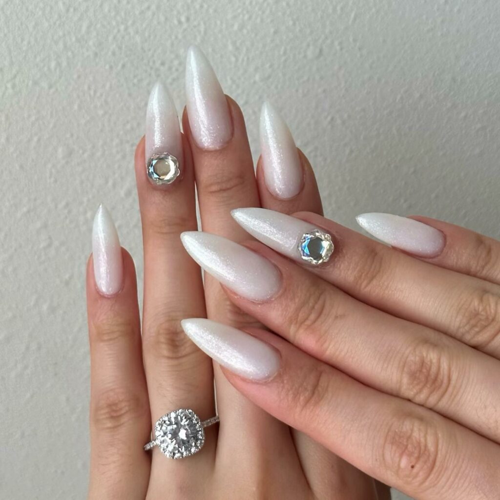 Glow with 20 Pearl White Nail Designs in 2024 13 White Pearl Nail With Huge Rhinestones